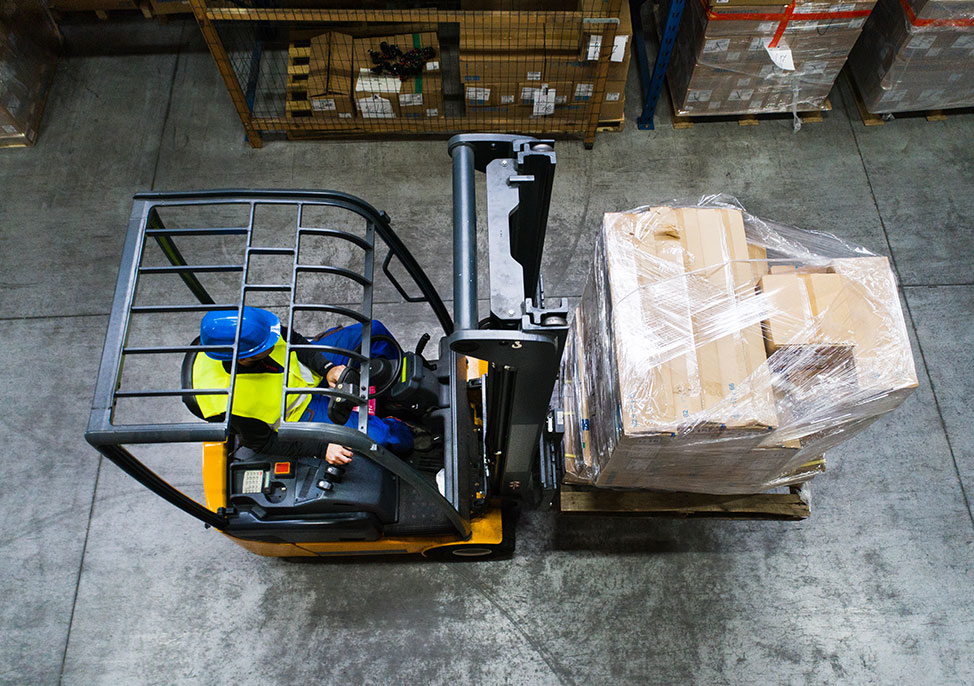 Man operating forklift